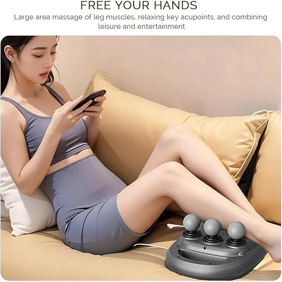 Woman relaxing on a couch using the six-head massager on her legs while using a phone