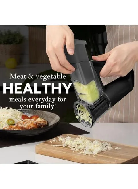 Close-up of a handheld electric vegetable slicer in operation