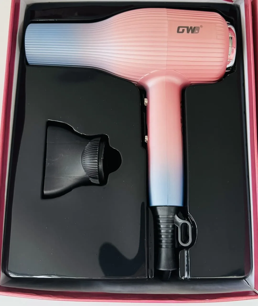 GW professional hair dryer in its storage box with nozzle attachment