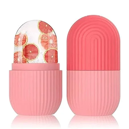Two pink facial ice roller silicone molds shown with one filled with grapefruit slices