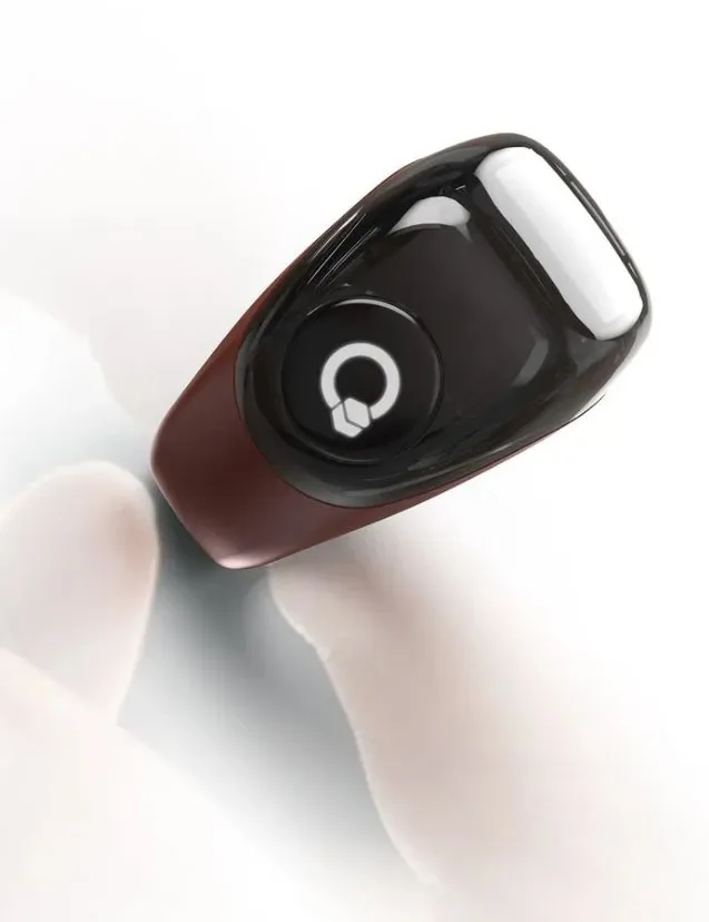 Close up of the Digital Smart Zikr Ring held between fingers